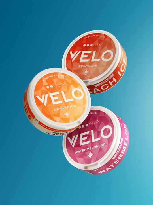 Peach Ice, Watermelon Ice, and Orange Ice Velo Mini pouches floating on a blue background