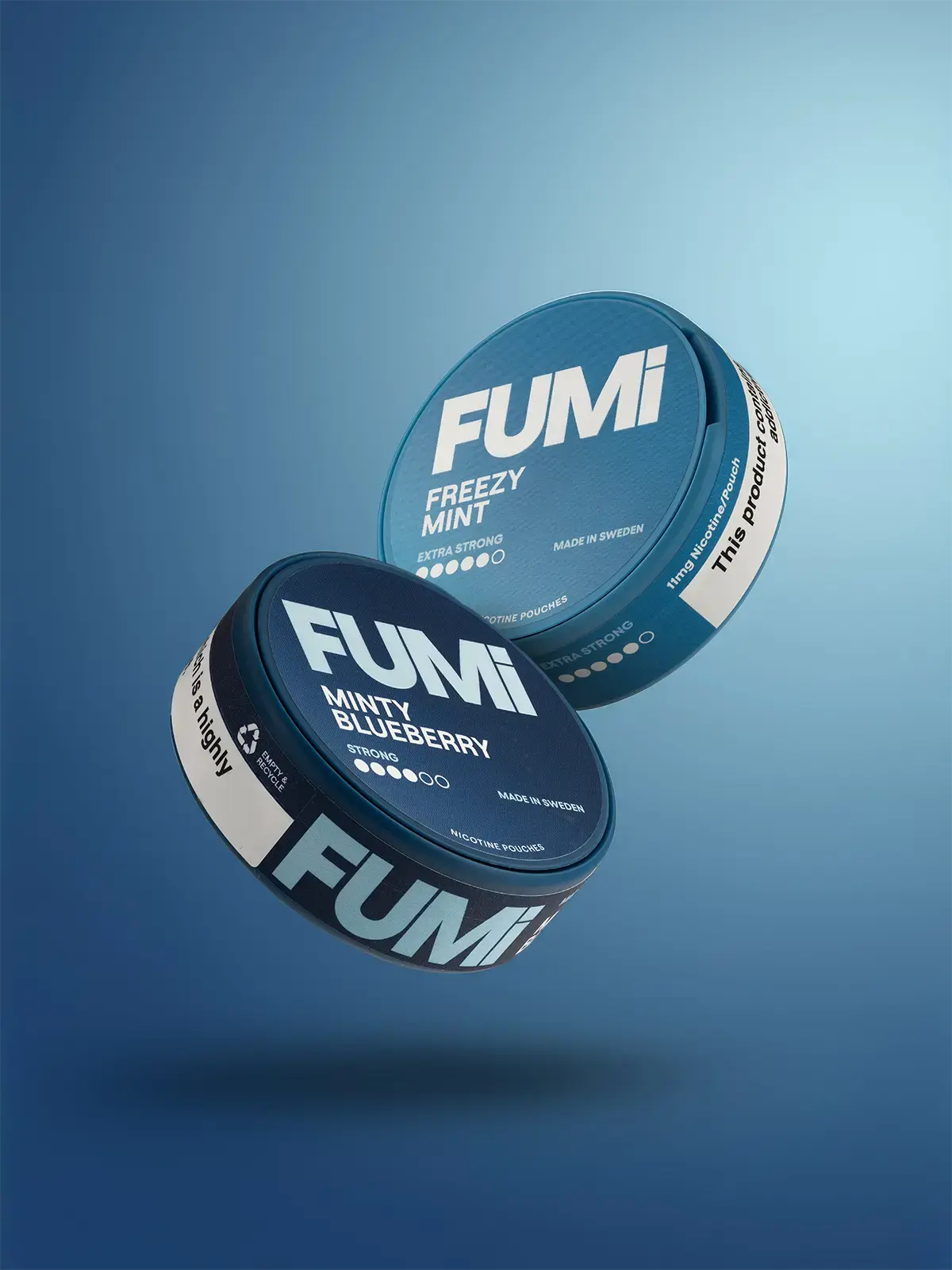 Freezy Mint FUMi pouches and Minty Blueberry FUMi pouches floating side-by-side on a blue background
